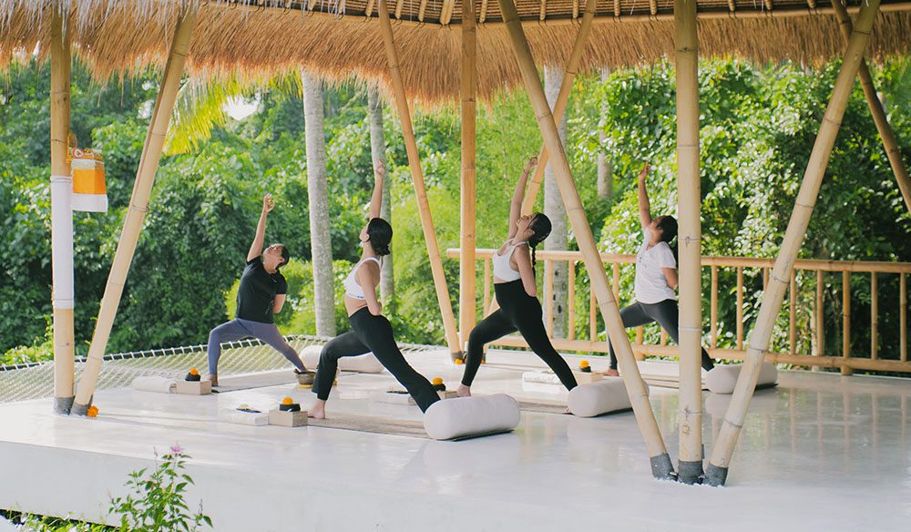 Women doing yoga on a Luxury and Transformation for Women with Goddess Retreats 