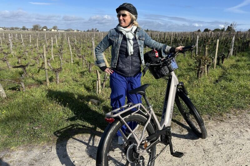 Carolyn ebiking amongst the vineyards in Bordeaux France