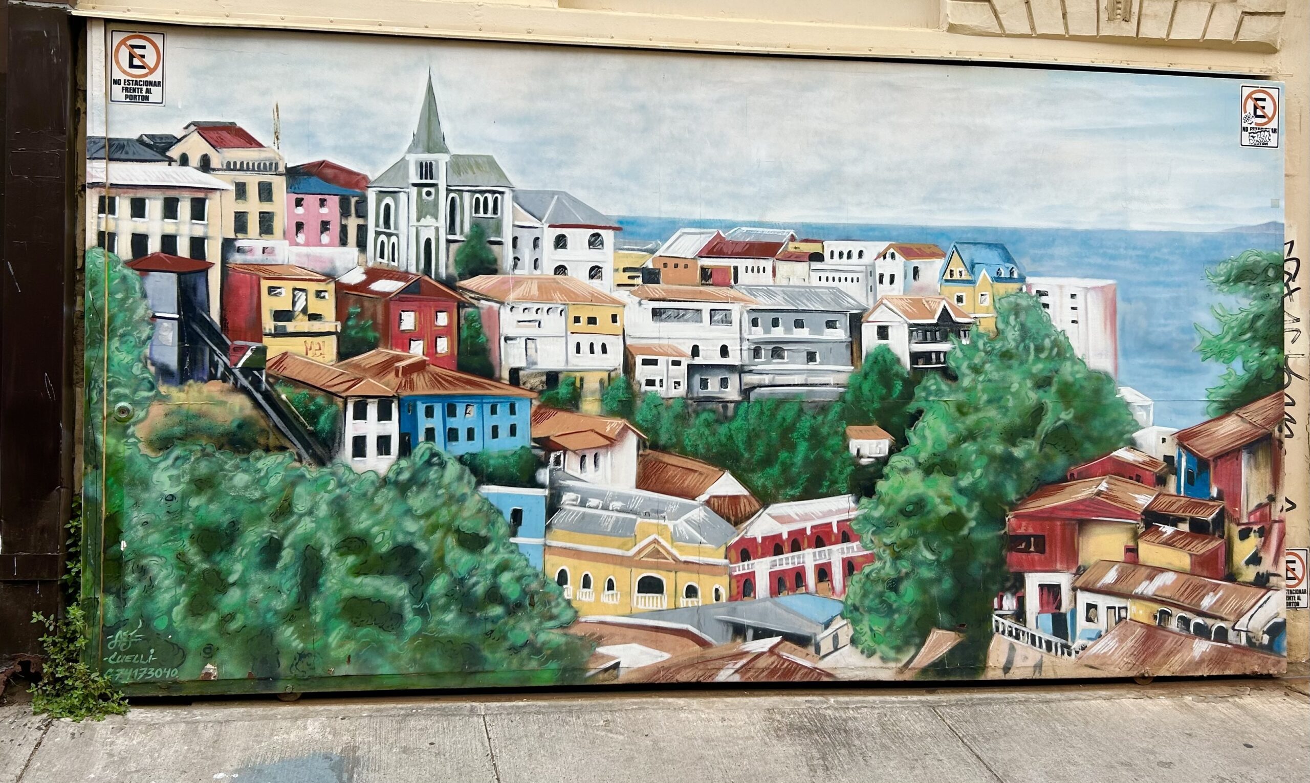 mural with colourful houses in valparaiso chile