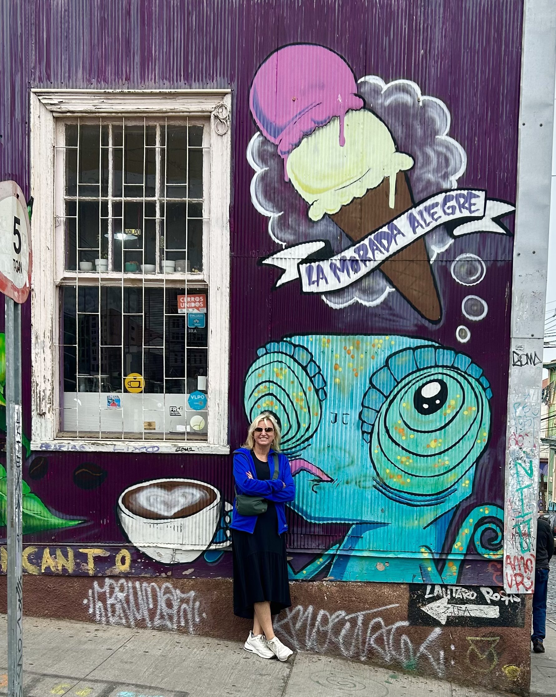 street art valparaiso woman in front of mural