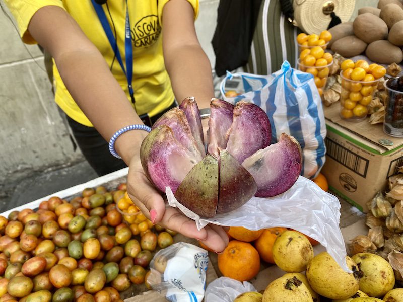 Trying local fruit in Cartagena on a food tour