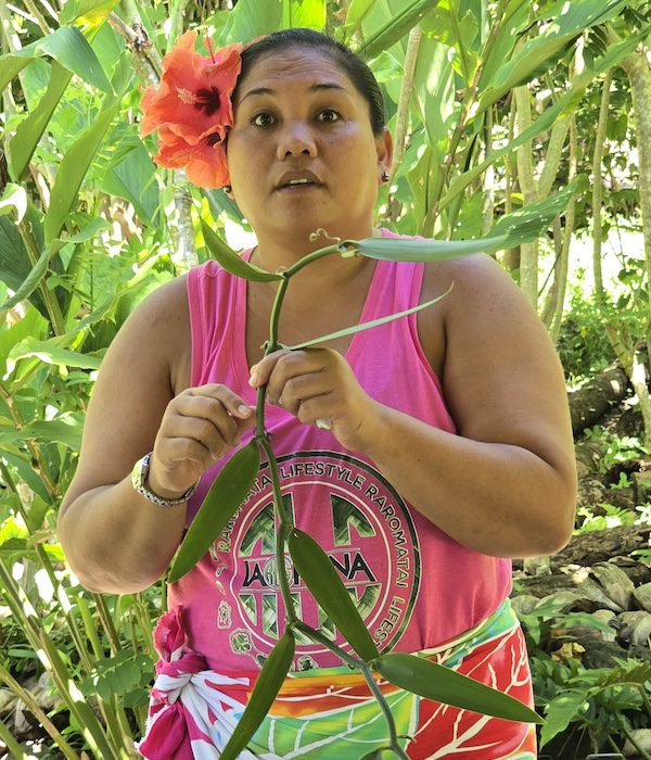 A woman explaining the vanilla growing and extraction process in French Polynesia