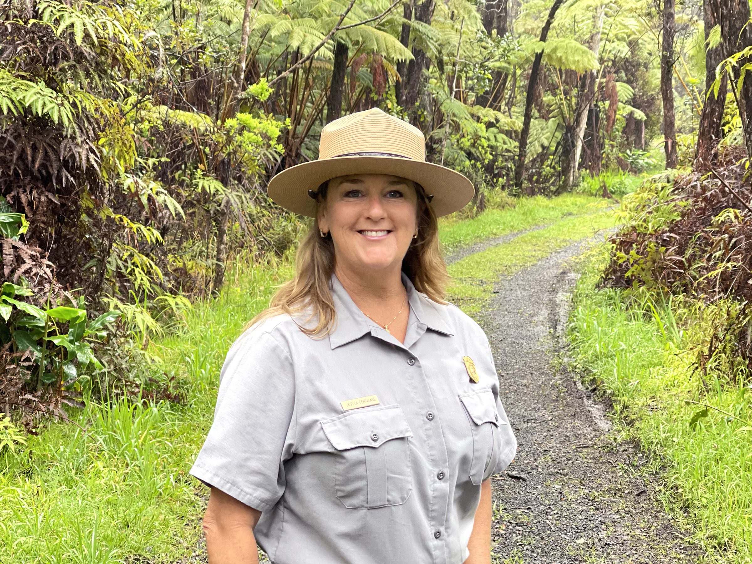 woman standing in a forest hawaii