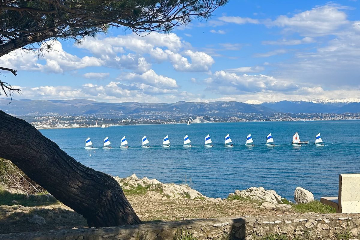 Sailboats sail along Côte d’Azur in the Low Season in Antibes, France