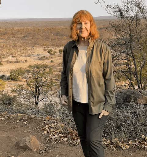 Diana Eden in front of African plains