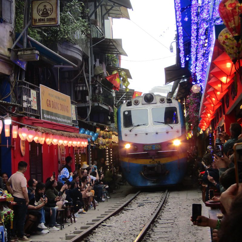A train driving through Hanoi’s Train Street in Vietam 
