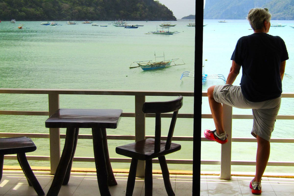 Kim absorbing the view from our balcony at El Nido Beach Hotel, Palawan Island, Philippines.
