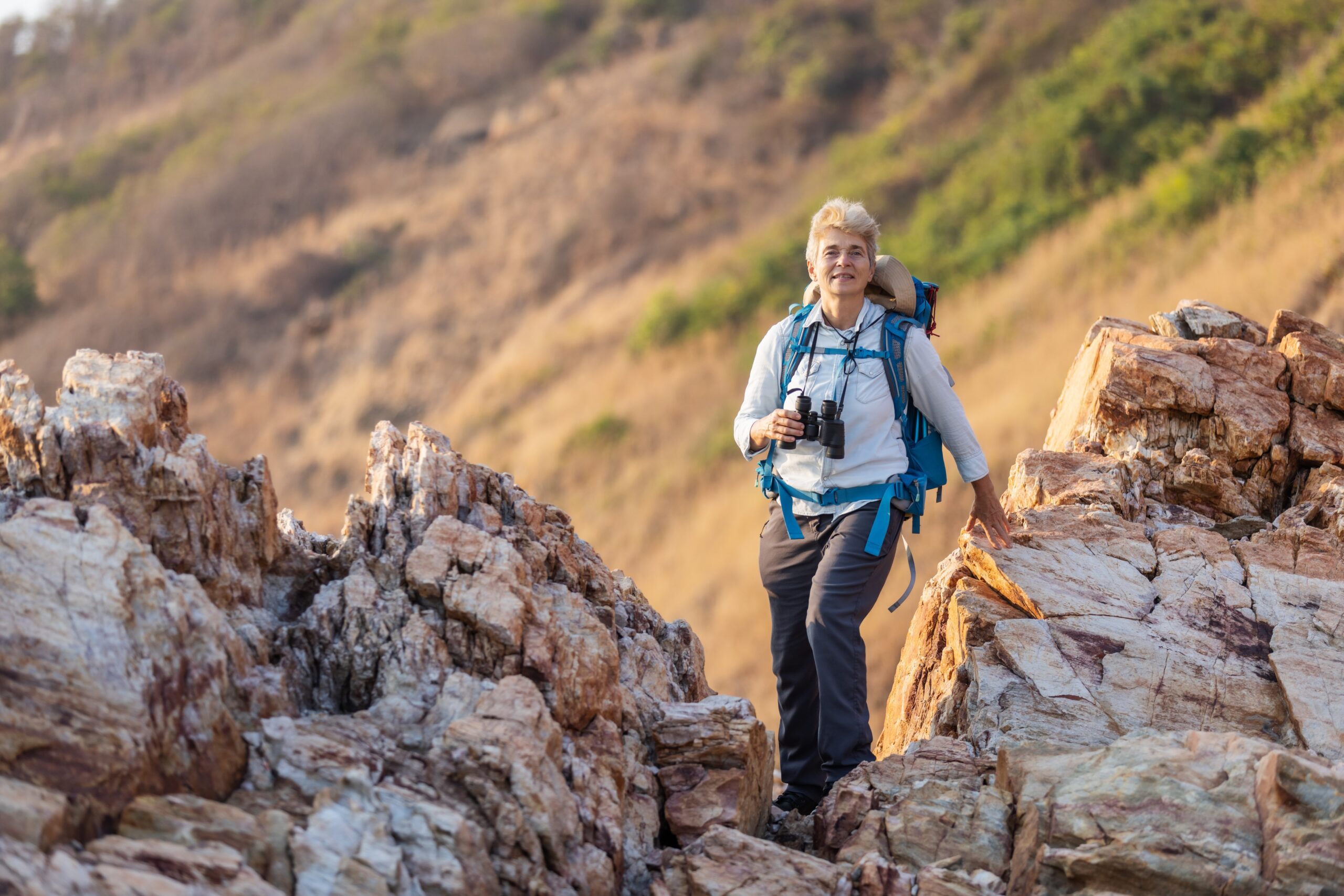 adventurous woman over 50 solo travel hiking
