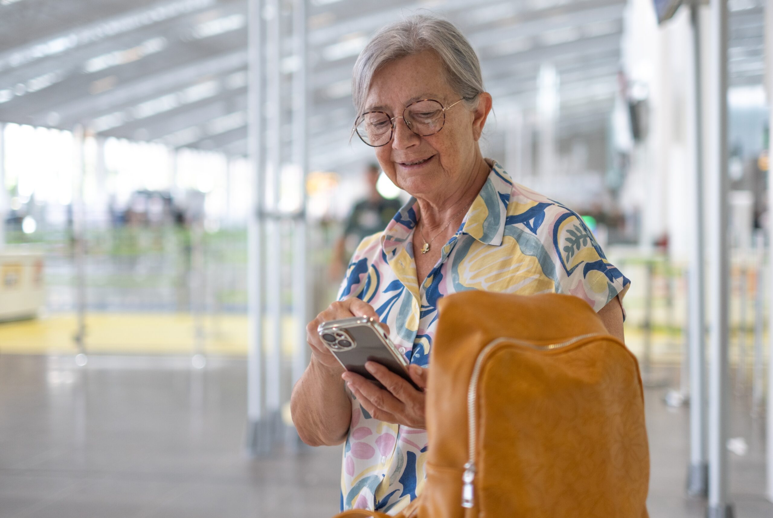 woman using mobile phone esim in airport