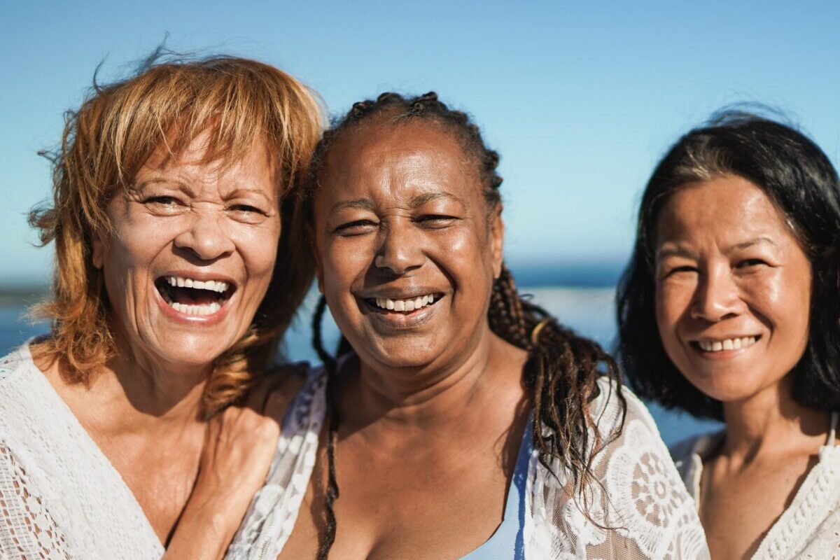 group of joyful mature women travel over 50